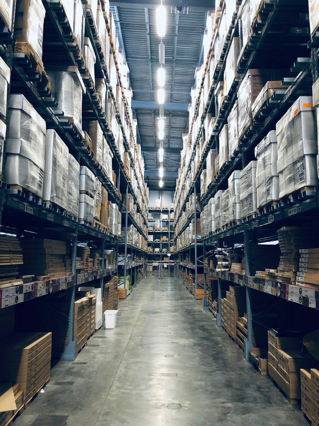 Wholesale warehouse aisle with stocked shelves